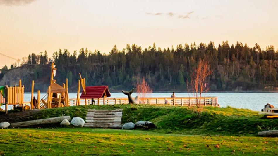 A small playground on the edge of the water. 