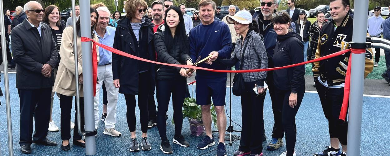 West Vancouver Mayor, members of Council, and community supporters prepare to cut the ribbon and open the Keen Lau Fitness Circuit